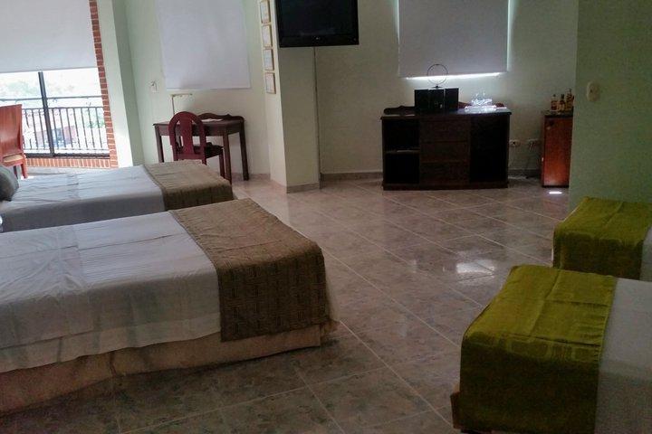 Casa Morales Hotel Internacional Y Centro De Convenciones Ibagué Kültér fotó A room at the hotel